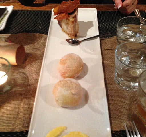 Colaturo butter, fresh bread and a bone marrow topped with risotto milanese bread.